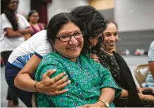  ??  ?? Classical Indian dance teacher Rathna Kumar gets a hug from Henna Patel, the artistic director and co-producer of “Woven,” a 90-minute show that explores the Indian-American experience.