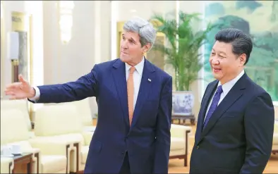  ?? WU ZHIYI / CHINA DAILY ?? President Xi Jinping escorts US Secretary of State John Kerry in Beijing on Wednesday.