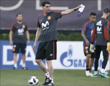  ??  ?? SHAKEUP AT THE TOP
Spain — one of the favorites to win the World Cup — sent a stir through the soccer world Wednesday when it fired Julen Lopetegui just days from its opener and replaced him with Fernando Hierro, pictured above running practice. Spain...