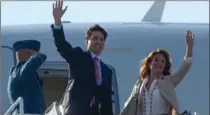  ?? SEAN KILPATRICK, THE CANADIAN PRESS ?? Prime Minister Justin Trudeau and his wife Sophie Gregoire-Trudeau depart Ottawa for Cuba on Tuesday.