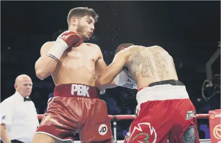  ??  ?? Josh Kelly in action against Jose Luis Zuniga. Picture by Lawrence Lustig.