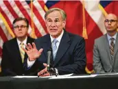  ?? Eric Gay / Associated Press ?? Gov. Greg Abbott’s efforts to restart Texas’ economy earned a thumbs-up tweet from the president Tuesday.