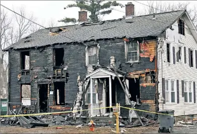  ?? ?? ‘TREMENDOUS LOSS’: A raging fire tore through this duplex in Somers, Conn., Tuesday, killing four children.