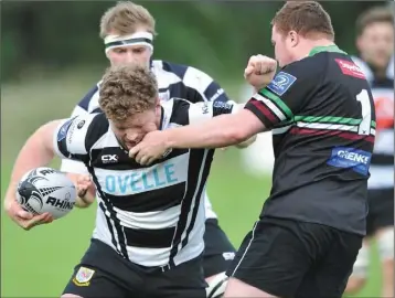  ??  ?? Dundalk’s John Smith gets a knock to the face.