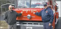  ?? STAFF PHOTO BY JESSI STICKEL ?? Bob Eastburn, left, and Elvan Hedges are the last active charter members of the Bryans Road Volunteer Fire Department. The two helped start the department in 1961; they said the community was reluctant at first, but it flourished into the active...