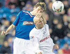  ??  ?? Joe Savage up against Rangers’ Kirk Broadfoot during his time with East Stirling