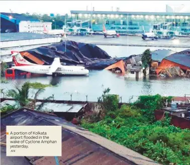  ?? ANI ?? A portion of Kolkata airport flooded in the wake of Cyclone Amphan yesterday.