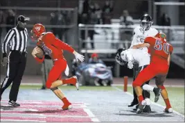  ?? Caroline Brehman ?? Las Vegas Review-journal Senior quarterbac­k Logan Bollinger scores the winning touchdown against Desert Pines in the Mountain Region semifinal clash at Arbor View High School.