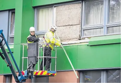  ?? Picture: PA. ?? Cladding is removed from Hanover tower block in Sheffield as Prime Minister Theresa May has said there must be a “major national investigat­ion” into the use of potentiall­y flammable cladding on buildings across the country.