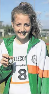  ??  ?? Sophie Barrins, Castleconn­or, who came first in the U14 80m Hurdles