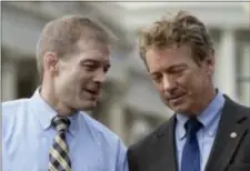  ?? SUSAN WALSH - THE ASSOCIATED PRESS ?? Rep. Jim Jordan, R-Ohio, left, talks with Sen. Rand Paul, R-Ky. during a news conference on health care, Tuesday, on Capitol Hill in Washington.