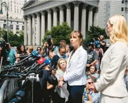  ?? JOHN MINCHILLO/AP ?? Annie Farmer, center, one of the four accusers who testified against Ghislaine Maxwell at trial, speaks to the media Tuesday outside federal court in New York.
