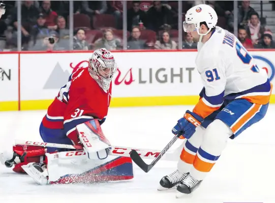  ?? JOHN MAHONEY FILES ?? The New York Islanders’ John Tavares puts the puck past Canadiens goalie Carey Price for a short-handed goal back in January. Tavares becomes a free agent on June 24 if he does not re-sign with the Islanders, who on Tuesday fired GM Garth Snow and head...