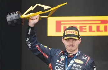  ?? THE CANADIAN PRESS PHOTO BY PAUL CHIASSON VIA AP ?? Red Bull driver Max Verstappen celebrates after winning Formula One’s Canadian Grand Prix on Sunday in Montreal. It was his 41st career victory, matching the late Ayrton Senna for fifth on F1’s all-time list.