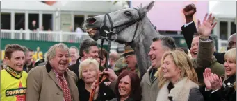  ??  ?? Daryl Jacob, owner John Hales, trainer Paul Nicholls, and delighted supporters after the Grand National win on this day eight years ago.