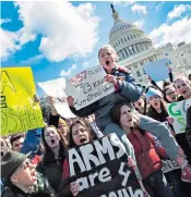  ??  ?? Students protest outside Capitol Hill, Washington, urging Republican leaders in Congress ‘to allow votes on gun violence prevention legislatio­n’