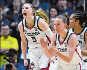  ?? JESSICA HILL/AP PHOTO ?? UConn guard Paige Bueckers (5) reacts in the first half of a game against Marquette in the semifinals of the Big East Conference tournament on March 10 at Mohegan Sun.