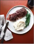  ?? The Associated Press ?? This strip steak Diane is from a recipe by Katie Workman.