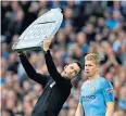  ??  ?? Warm welcome: Kevin De Bruyne comes on to a rapturous reception from City fans