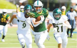  ?? RICK KINTZEL/THE MORNING CALL ?? Central Catholic receiver Griffin Patridge scores a touchdown after catching a pass against Emmaus at J. Birney Crum Stadium earlier this season.