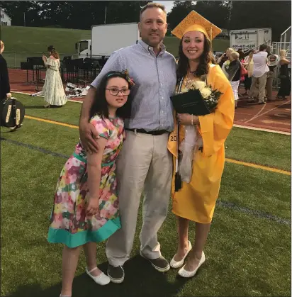  ?? Photos courtesy of the Gendron family & Bryant University ?? In the above photo, Ron Gendron is pictured with daughters Susan, left, and Sara on the June 2018 day that Sara graduated from North Smithfield High School. A standout swimmer for the Northmen, Sara has continued her aquatics career at Bryant University where her dad Ron has enjoyed a successful run as head coach of the Bulldogs’ men’s tennis program.