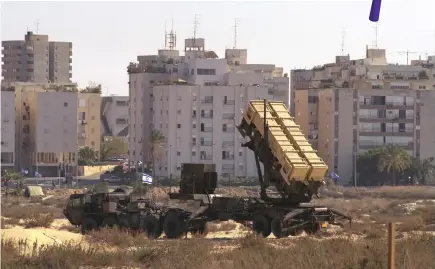  ?? (Photos: Nathan Alpert/GPO) ?? A PATRIOT missile intercepto­r in Tel Aviv ready to shoot down Scud missiles fired from Iraq.