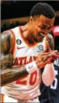  ?? BUTCH DILL/ASSOCIATED PRESS ?? Hawks forward John Collins says Nate Mcmillan may be better suited to coaching a veteran team.