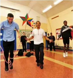  ??  ?? FOLLOW THE LEADER: De’roux teaches some youngsters to skip