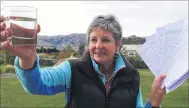  ?? PHOTO: TIM MILLER ?? Keep it pure . . . Luggate resident Cec Anderson with a glass of the town’s untreated water and a survey opposing the chlorinati­on of the water supply.