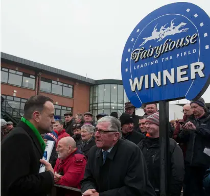  ??  ?? STABLE NATION: Leo Varadkar speaking to ex-FG politician Tom Hayes at the Irish Grand National at Fairyhouse