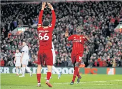  ?? REUTERS ?? Liverpool’s Sadio Mane, right, celebrates his goal against West Ham.