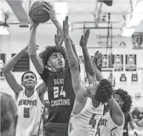  ?? MATT STONE/COURIER JOURNAL ?? Great Crossing's Malachi Moreno (24) goes for two against Newport at Thursday’s 2023 Chad Gardner Law King of the Bluegrass holiday basketball tournament at Fairdale High on Dec. 21.