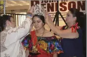  ??  ?? Calexico Chamber of Commerce Director Hildy Carrillo and Mayor Maritza Hurtado place the 2018 Senorita Mariachi Festival crown on Estefania Velazquez on Wednesday at the kickoff event for the 27th annual Mariachi Festival Sin Fronteras. JULIO MORALES...