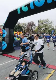  ??  ?? It was a family affair on the downtown streets for Sunday’s Times Colonist 10K.