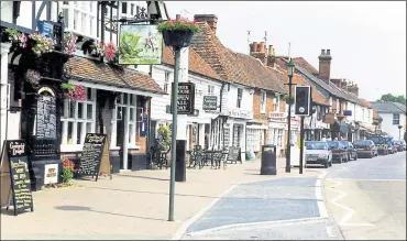  ?? ?? Maidstone council proposes cleaving off part of Lenham and adding it to an enlarged Headcorn, above, which is seven miles away. Parish chairman Cllr John Britt, right, urged a rethink, warning MBC not to ‘ride roughshod’ over the community