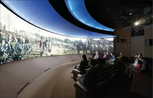  ??  ?? ABOVE: “The Siege of Yorktown,” a film shown on an 180-degree screen with special theater effects, transports visitors to the Battle of the Capes and Siege of Yorktown in 1781.