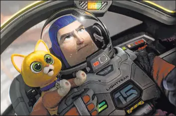  ?? Disney/Pixar ?? Buzz Lightyear (voiced by Chris Evans) with his emotional support robot cat, Sox (voiced by Peter Sohn), in a scene from “Lightyear,” in theaters this weekend.