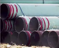  ?? Chris machian / Omaha WORLD-HERALD via ap ?? Pipes to be used for the Keystone Xl pipeline are stored in a field near Dorchester, Neb., last month.