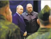  ?? Mikhail Metzel Kremlin Pool Photo ?? PRESIDENT Vladimir Putin, center left, visits a military base in Torzhok, Russia, on Wednesday.