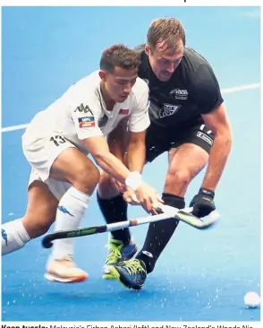  ??  ?? Keen tussle: Malaysia’s Firhan Ashari (left) and New Zealand’s Woods Nic fight for the ball during their Test match at the National Hockey Stadium in Bukit Jalil yesterday.— FAIHAN GHANI / The Star