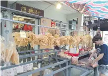  ?? LISA MONFORTON/ CALGARY HERALD ?? The outdoor markets in Tai-O, one of the oldest fishing villages near Hong Kong, is a popular way to spend a day away from the bustle of Hong Kong.