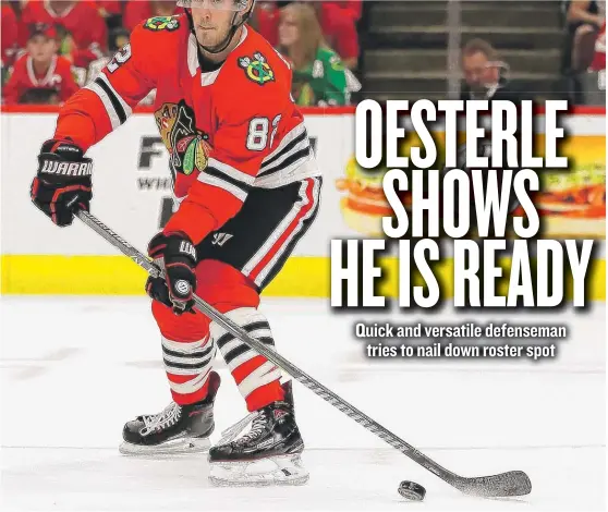  ??  ?? Jordan Oesterle signed a two- year deal this summer, but he may not make the cut if Hawks coach Joel Quennevill­e opts for only seven defensemen. | JONATHAN DANIEL/ GETTY IMAGES