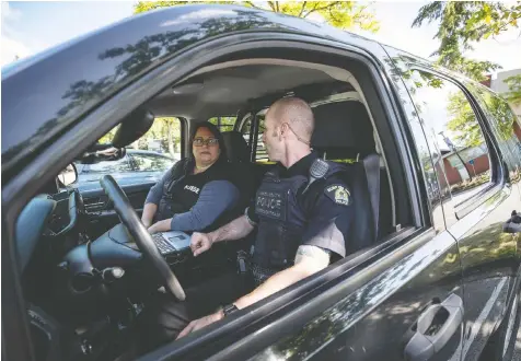  ?? THE CANADIAN PRESS ?? Registered psychiatri­c nurse Tina Baker, left, and RCMP Cpl. Scotty Schumann, acting sergeant in charge of the Surrey RCMP mental health outreach team.