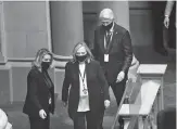  ?? Getty Images/tns ?? New York Electoral College members, Former Secretary of State Hillary Clinton (L), and Former President Bill Clinton arrive to vote for President and Vice President in the Assembly Chamber at the state Capitol in Albany, New York on December 14.