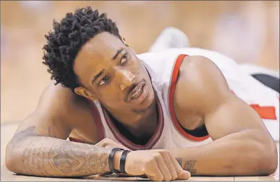  ?? CP PHOTO ?? Toronto Raptors guard DeMar DeRozan lies on the floor after committing a foul against the Cleveland Cavaliers during NBA playoff action in Toronto on Sunday.