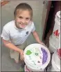  ?? / Darlington ?? Darlington fourth-grader Sara Jo Pierce displays a lid she decorated.