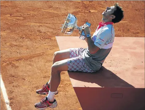  ?? Picture: AFP ?? SPOT IN THE SUN: Switzerlan­d’s Stanislas Wawrinka celebrates his French Open victory over Novak Djokovic of Serbia at Roland Garros yesterday. The champion showed extraordin­ary determinat­ion to win his second career Grand Slam title.