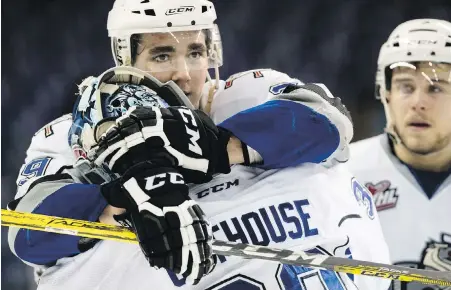  ??  ?? Royals defenceman Chaz Reddekopp consoles goaltender Griffen Outhouse following their historic Game 6 loss on Sunday.