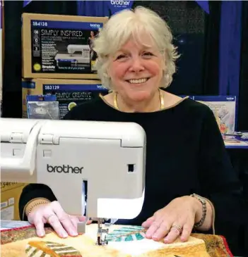  ??  ?? Deb Karasik working on her Falling Leaves Table Runner.