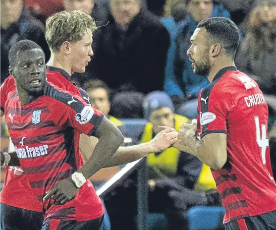  ?? Picture: SNS Group. ?? Dundee debutant Steven Caulker celebrates his goal with Mark O’hara.